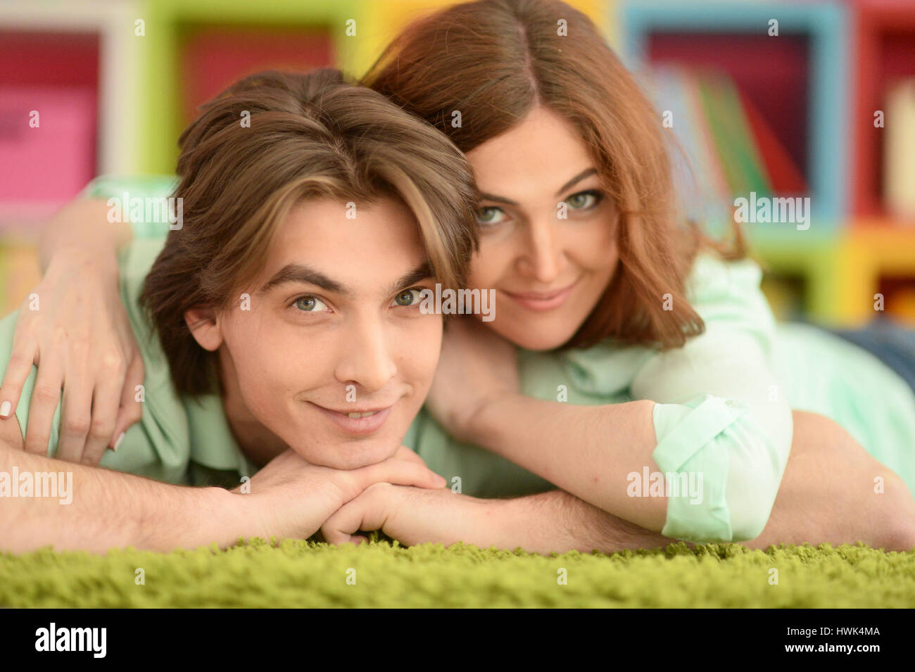 Portrait of a beautiful young couple hugging Stock Photo - Alamy