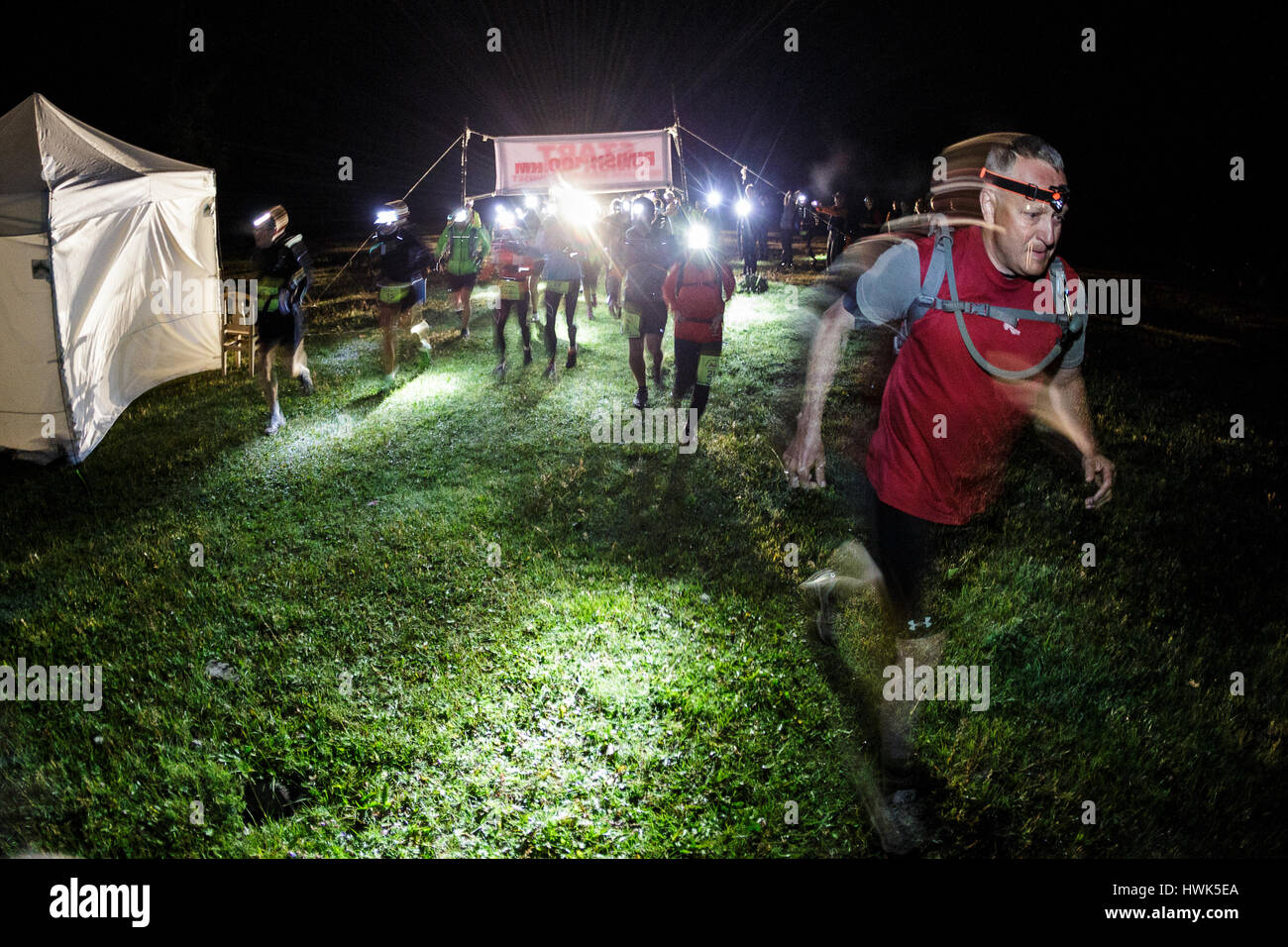 Participants attend the extreme run Sunrise to Sunset 2014 in Mongolia. The race is known as the world’s most beautiful 42 km and 100 km trail run and takes place near Lake Khuvsgul in Northern Mongolia. Stock Photo