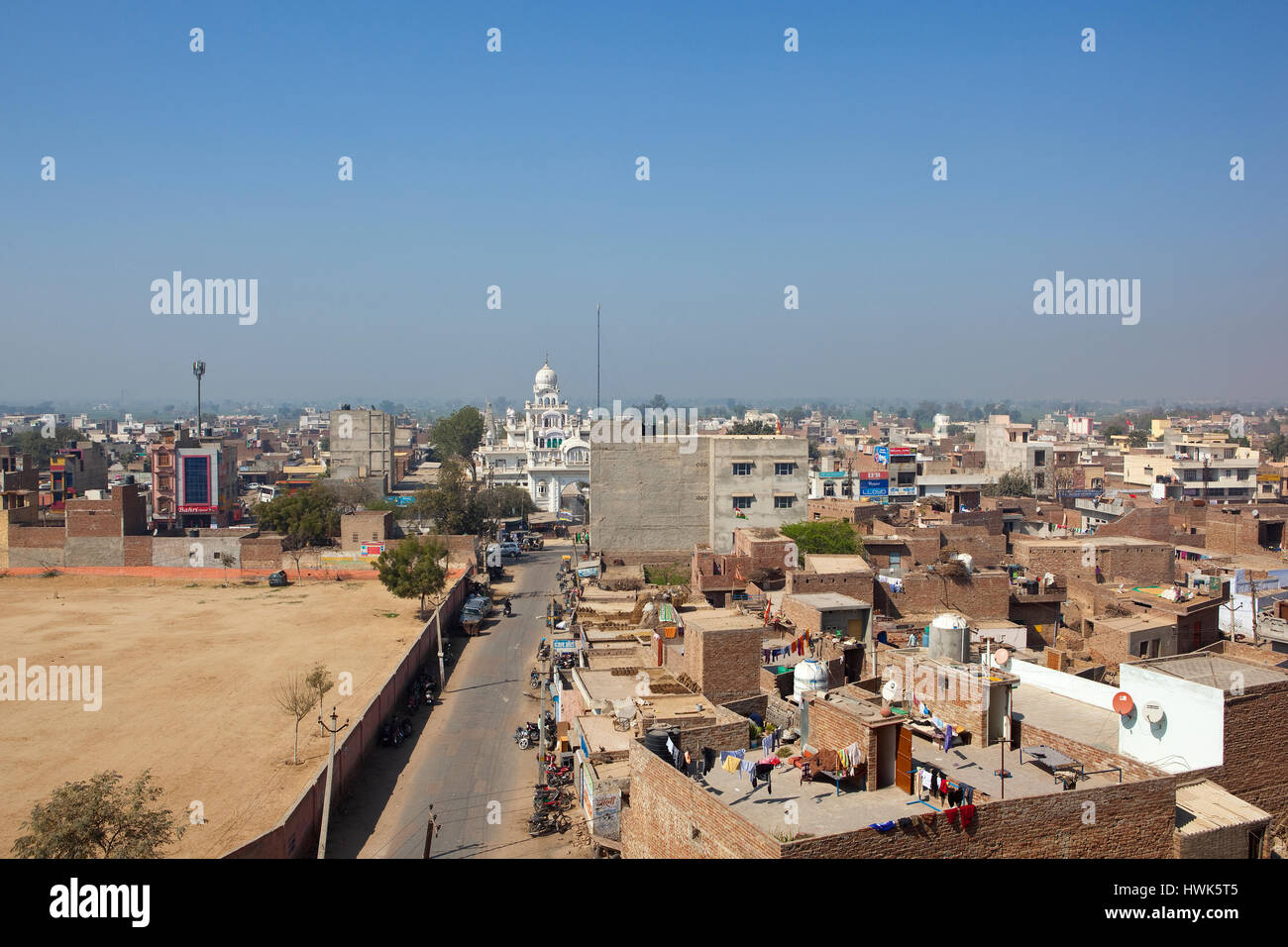 Aerial view of hanumangarh town with white gurdwara and buildings under a blue sky in rajasthan india Stock Photo
