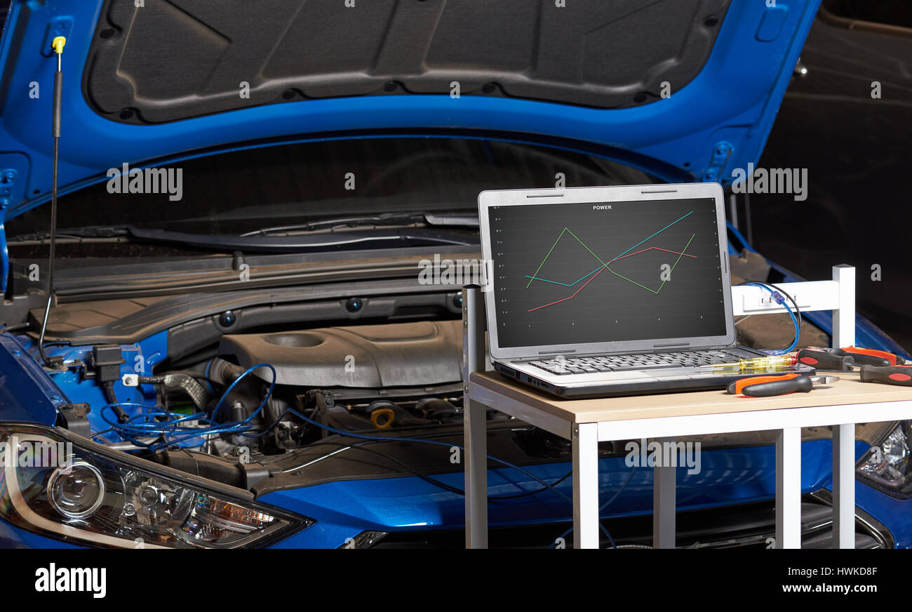 Modern car maintenance. Computer vehicle diagnostic Stock Photo