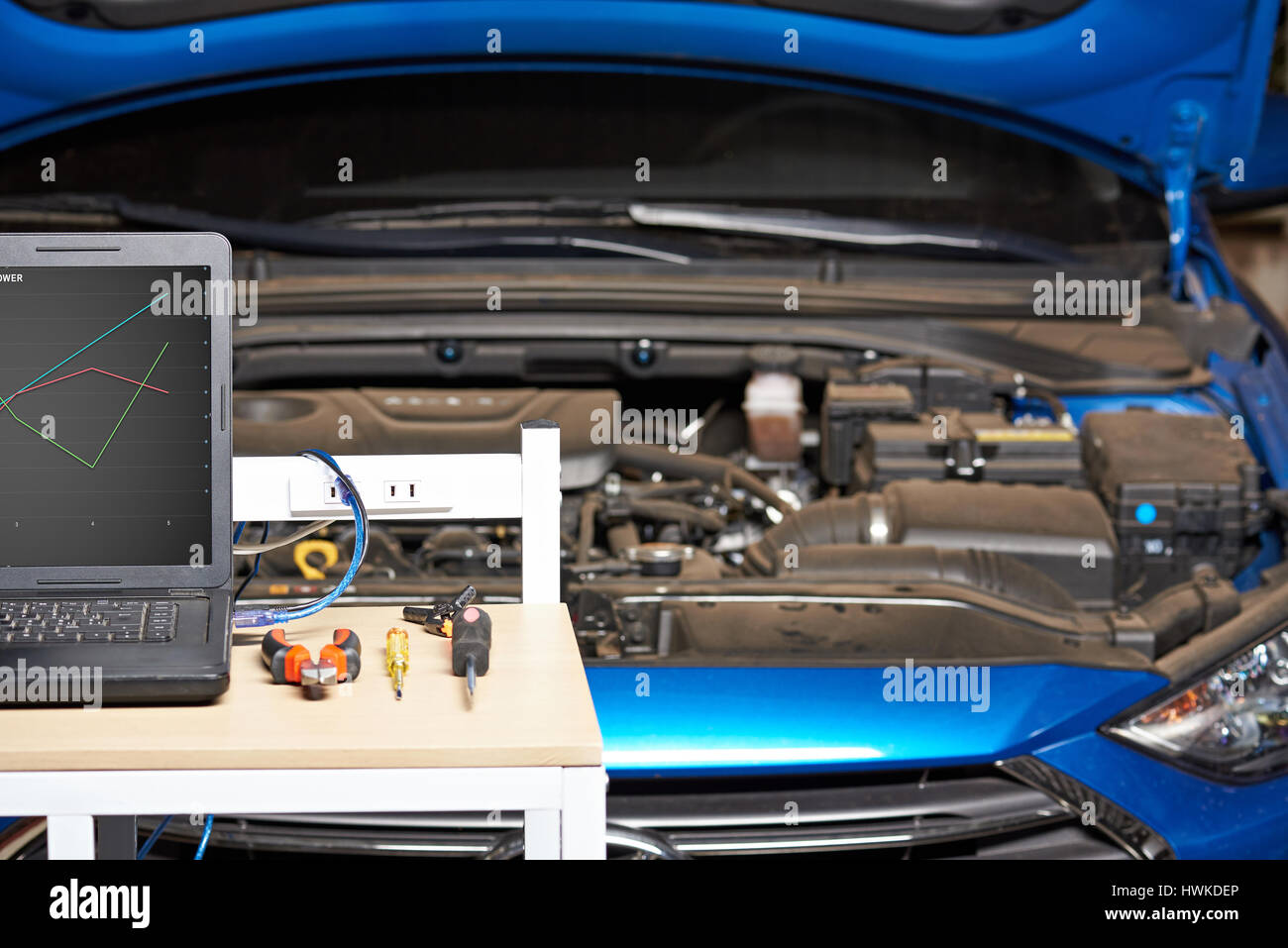 Closeup of mechanic car table on blurred vehicle background. Vehicle auto service Stock Photo