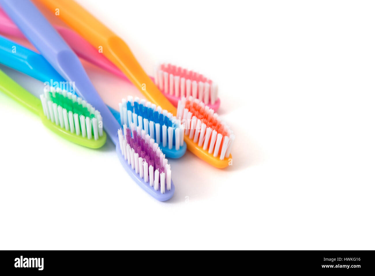 colorful toothbrushes on white background Stock Photo - Alamy