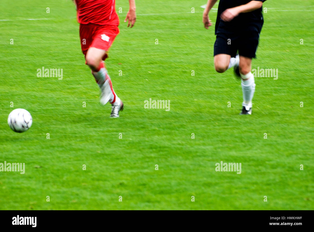 soccer or football players in action during a game Stock Photo