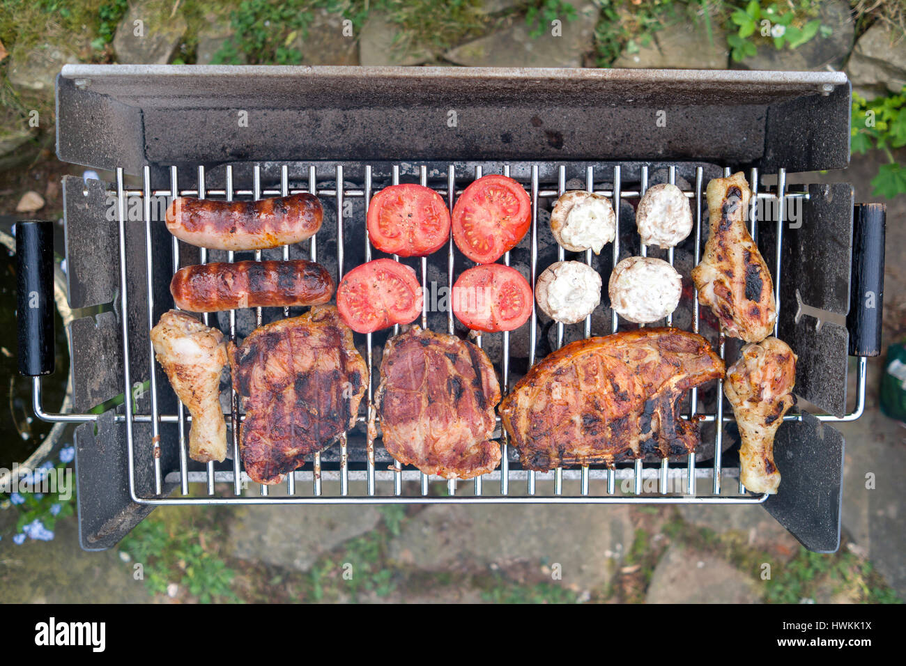 different meat and vegetables on grill with charcoal Stock Photo Alamy