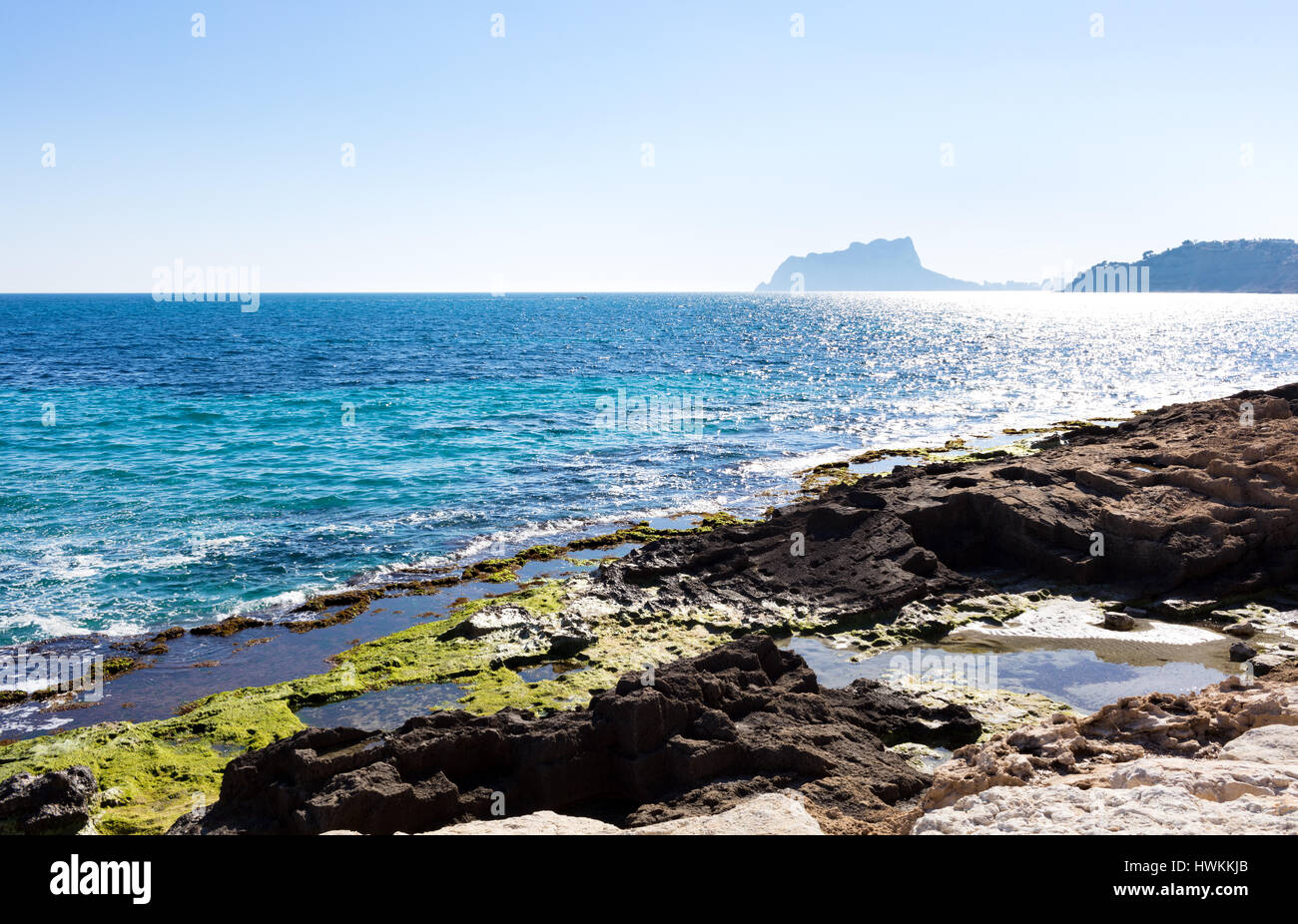Mediterranean coast just to go for a walk listening the waves and feeling the sun. Photo taken from Moraira walkway Stock Photo