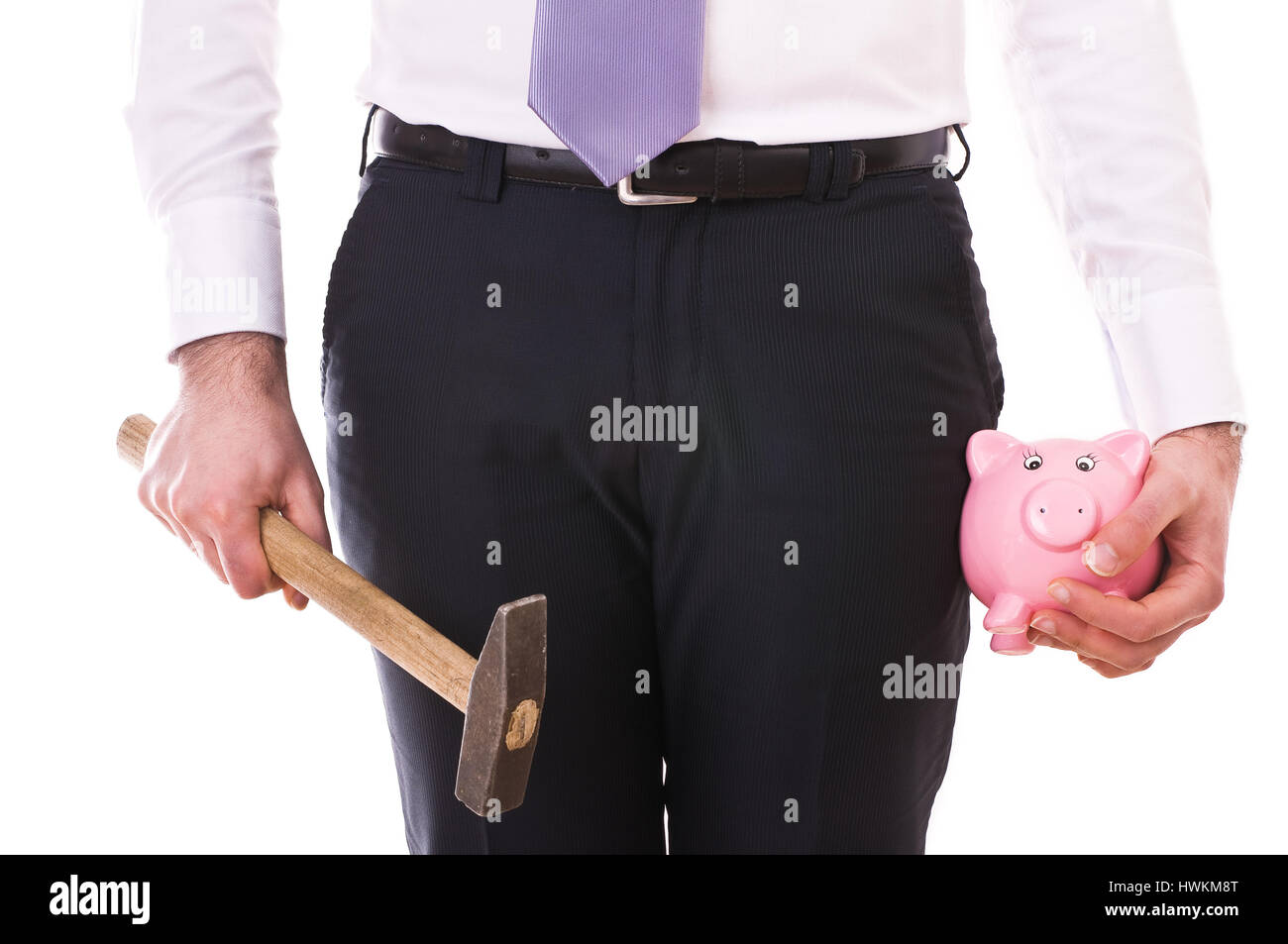 Businessman with piggy bank and hammer Stock Photo - Alamy