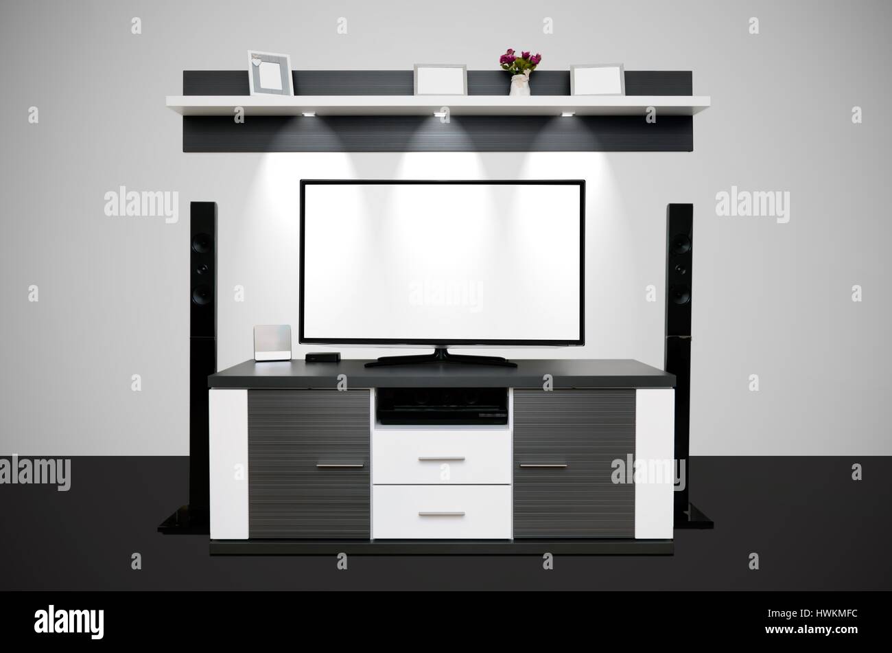Modern TV room with illuminated LED lamps in shelf Stock Photo Alamy
