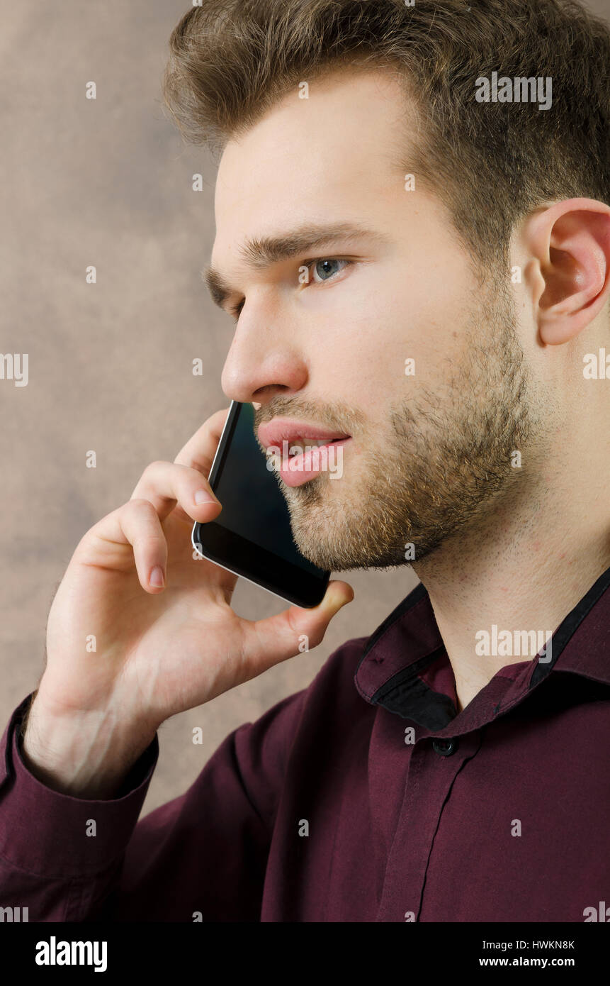 Handsome man talking on the phone copyspace. phone man talking call mobile calling business young concept Stock Photo