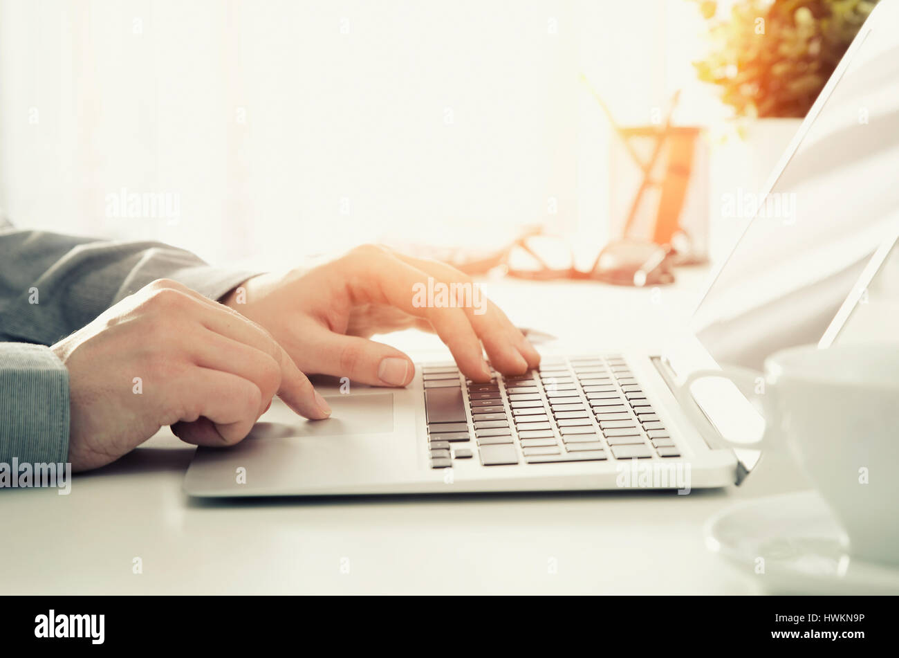 Man working in the office with laptop. computer business desk man work concept Stock Photo