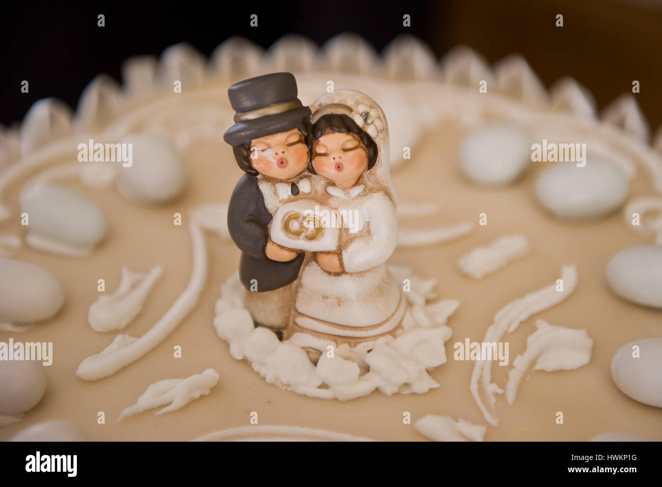 Bride and groom on a wedding cake topper Stock Photo - Alamy