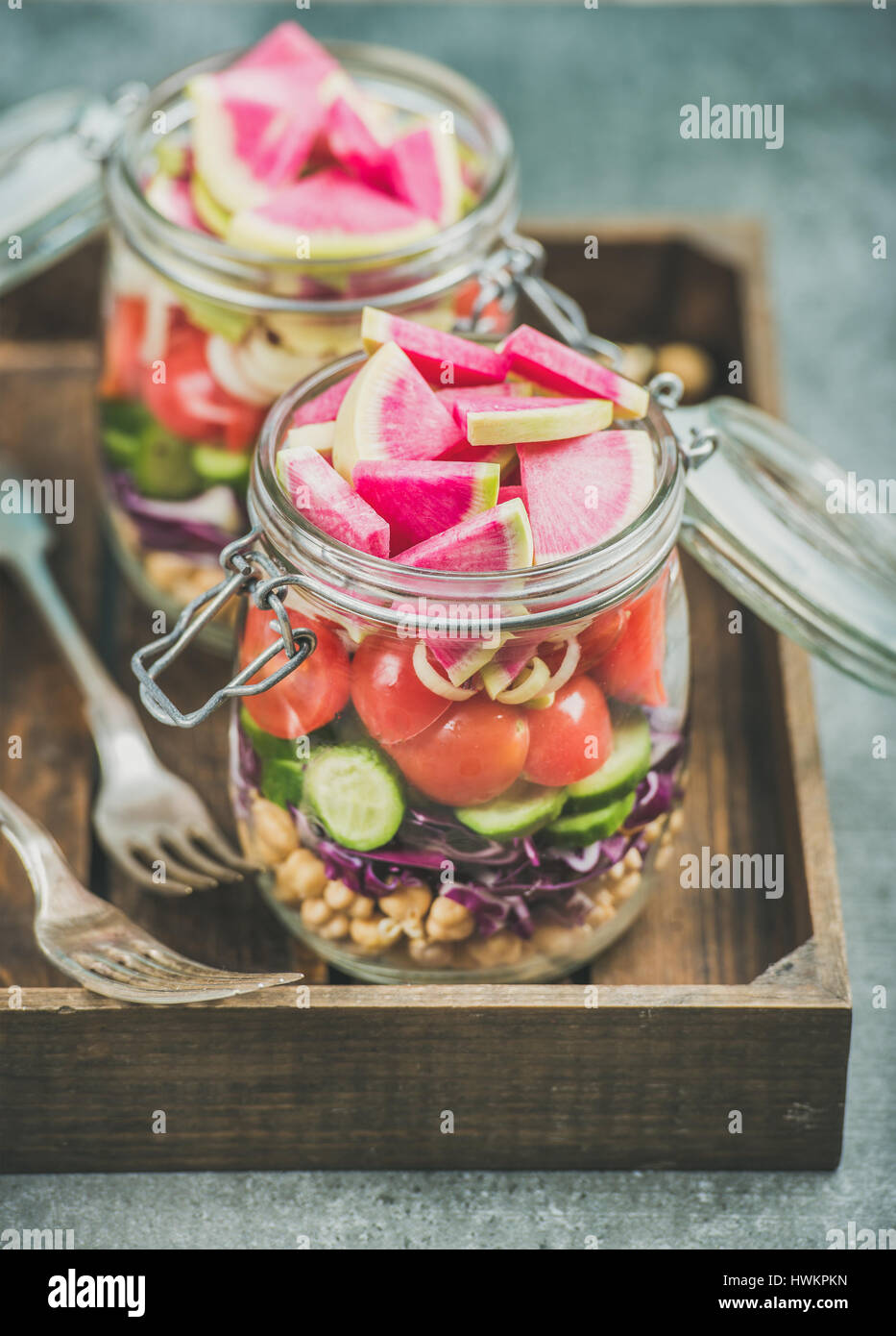 Close-up of healthy take-away jars. Vegetable and chickpea sprout vegan ...