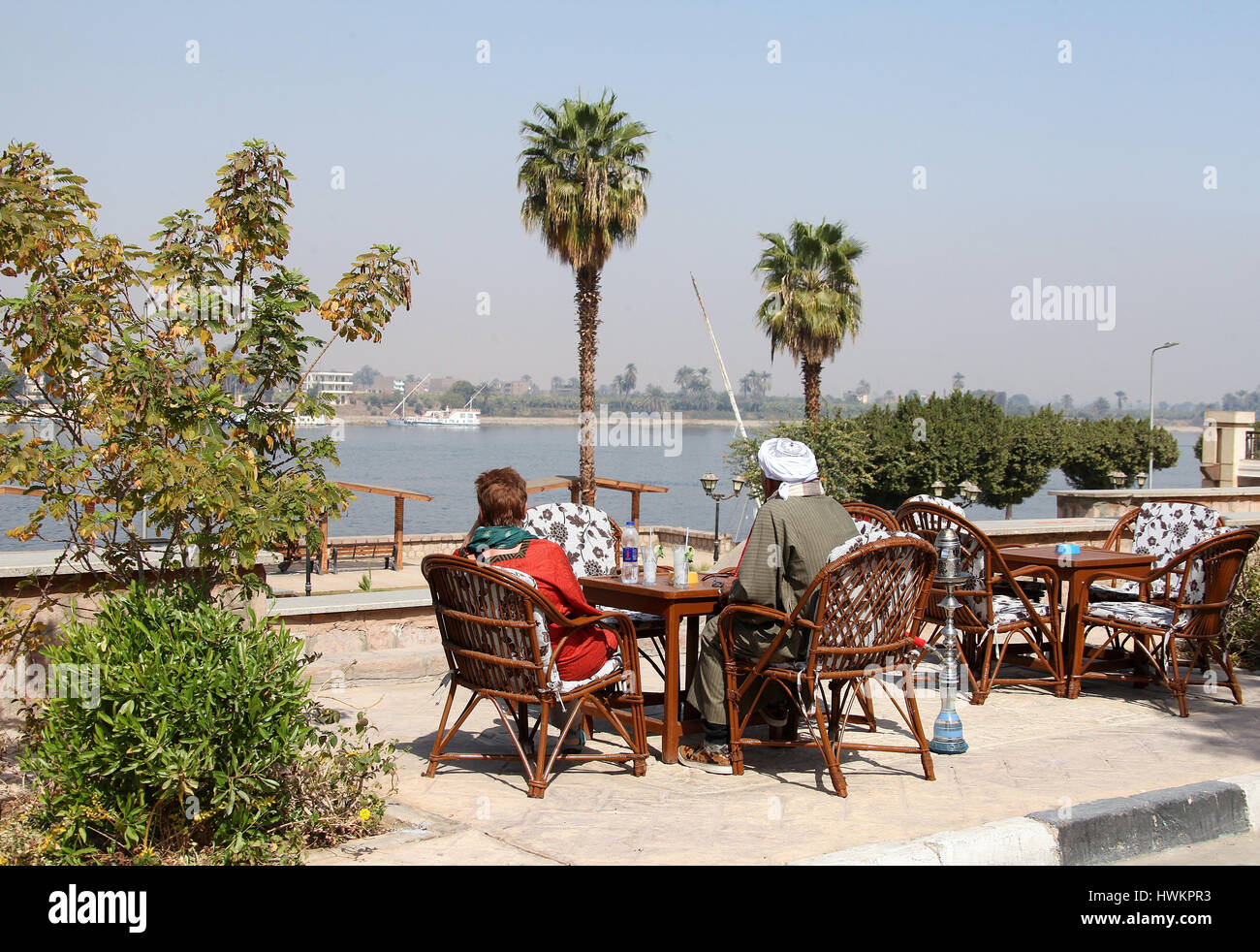 Relaxing by the River Nile at Luxor looking across to the West Bank Stock Photo