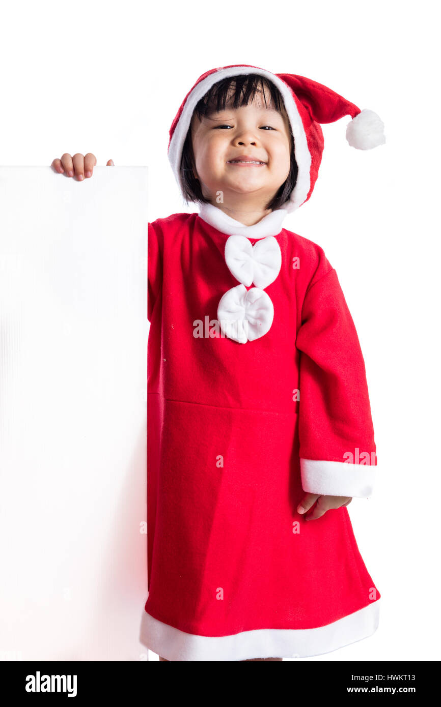 Asian Chinese little girl in santa costume holding blank message board ...