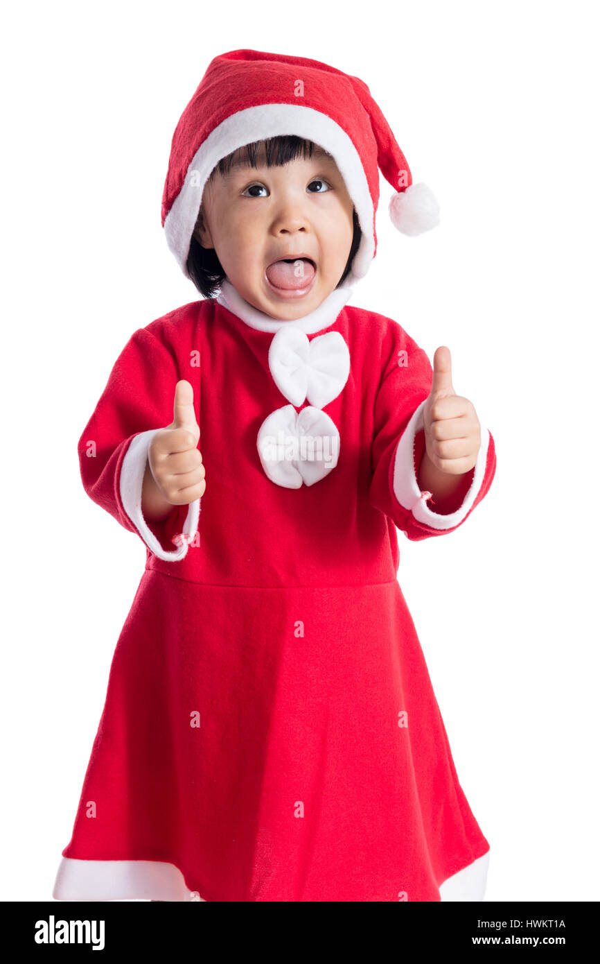 Happy Asian Chinese little santa claus girl with thumbs up in isolated ...
