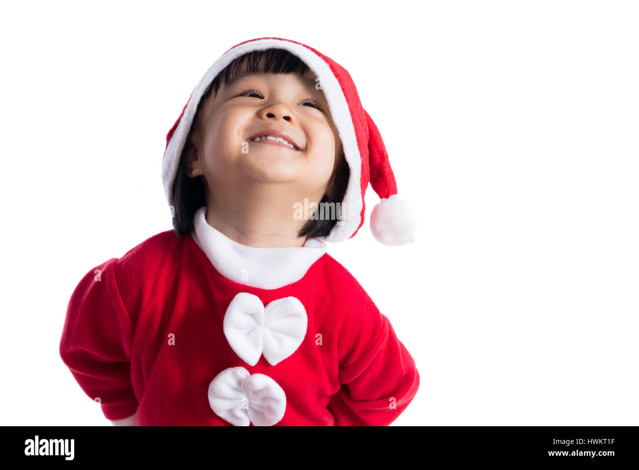 Happy Asian Chinese little girl wearing santa claus costume in isolated ...
