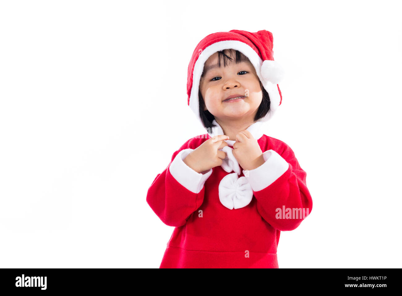 Happy Asian Chinese little girl wearing santa claus costume in isolated ...