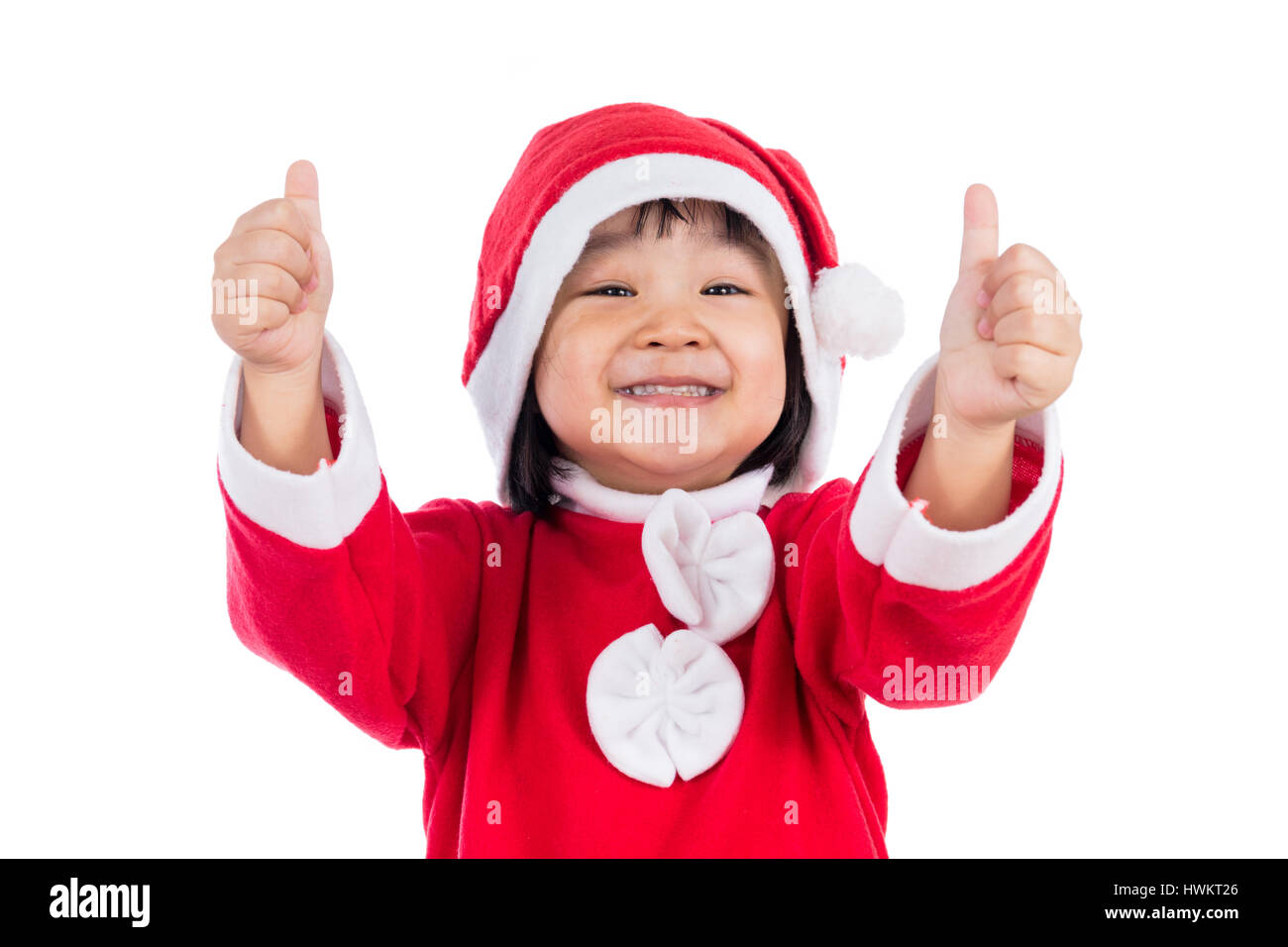 Happy Asian Chinese little santa claus girl with thumbs up in isolated ...