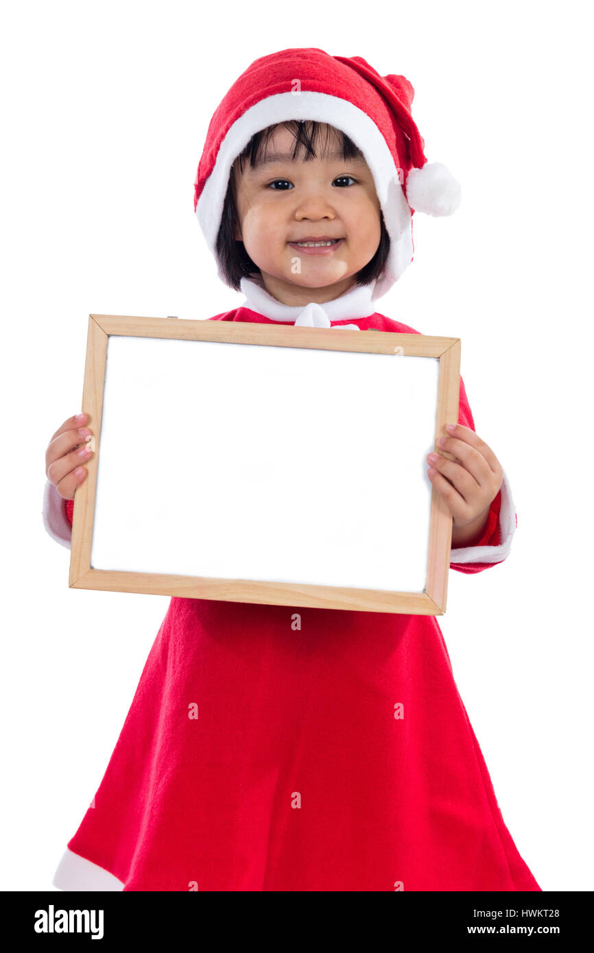 Asian Chinese little girl in santa costume holding blank message board