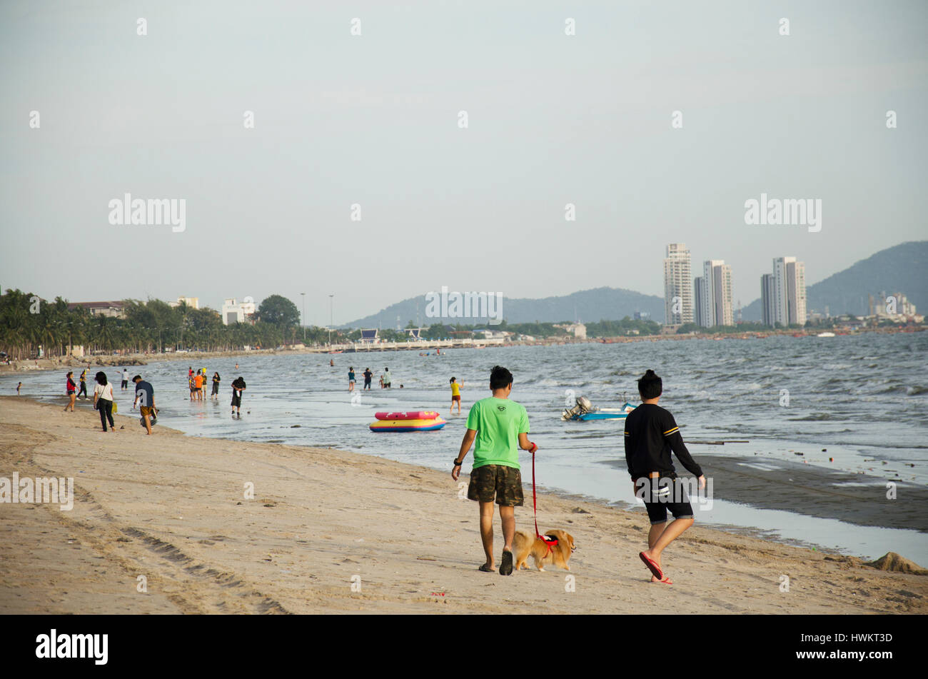 Happy asian family playing at the beach hi-res stock photography and ...