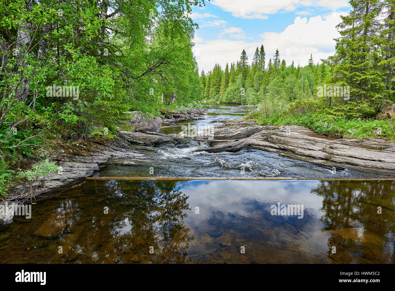 View of a small dam and a river Stock Photo - Alamy