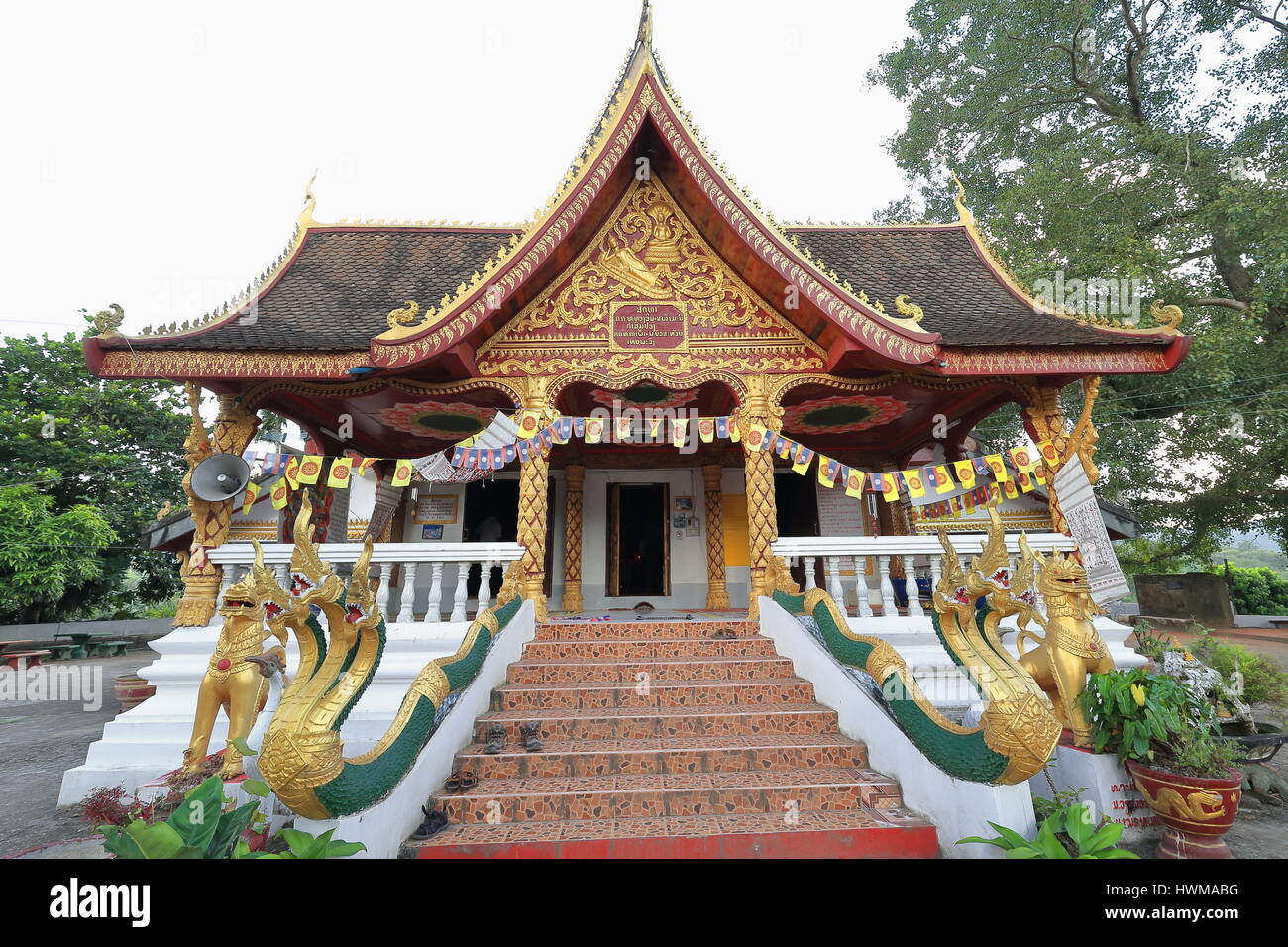 Muang La, Laos-October7, 2015: Wat Pha Singkham temple attracts people from whole Udomxai province to worship the 400 year old Buddha statue housed in Stock Photo