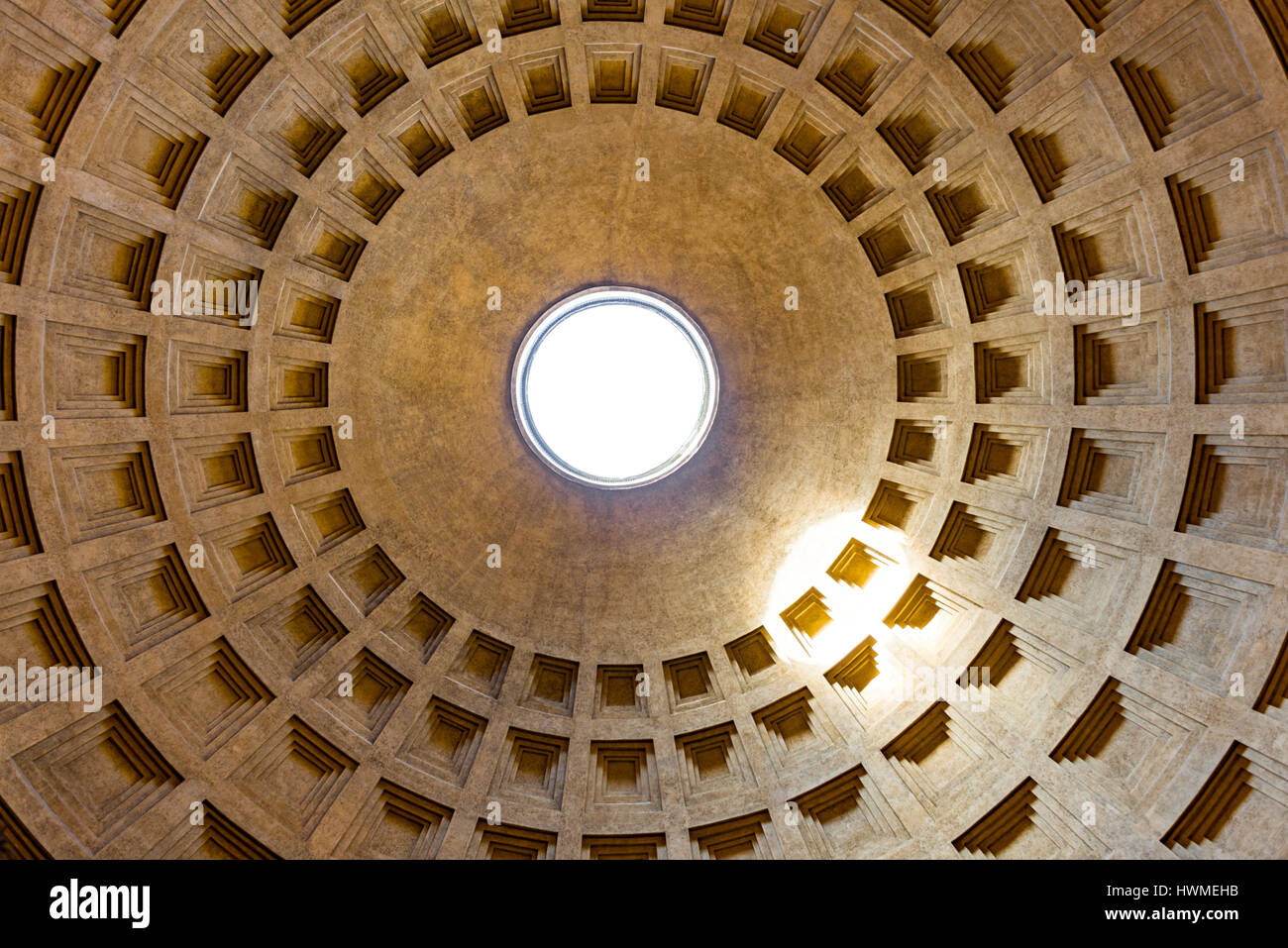 The dome of Pantheon, in Rome, with light coming through the central opening (oculus), as seen from the inside. Stock Photo