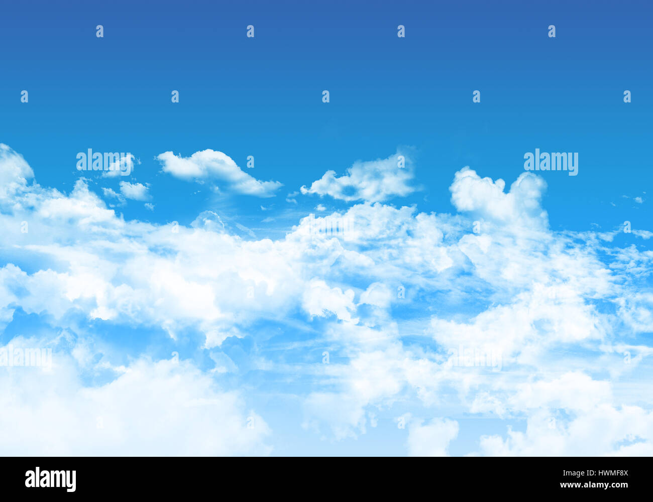 Blue sky background with fluffy white clouds Stock Photo - Alamy