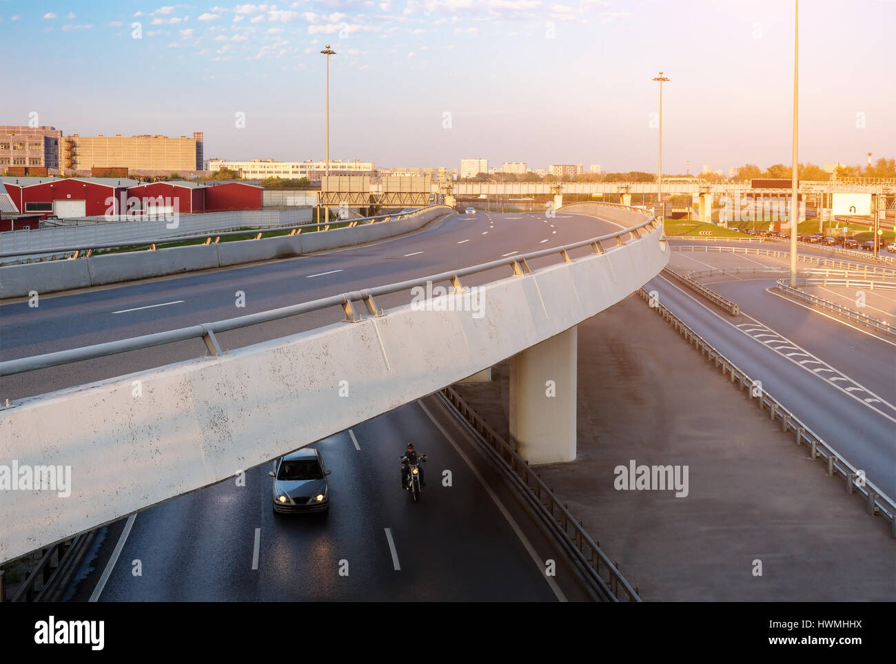 Overpass with car and motorbike underneath Stock Photo