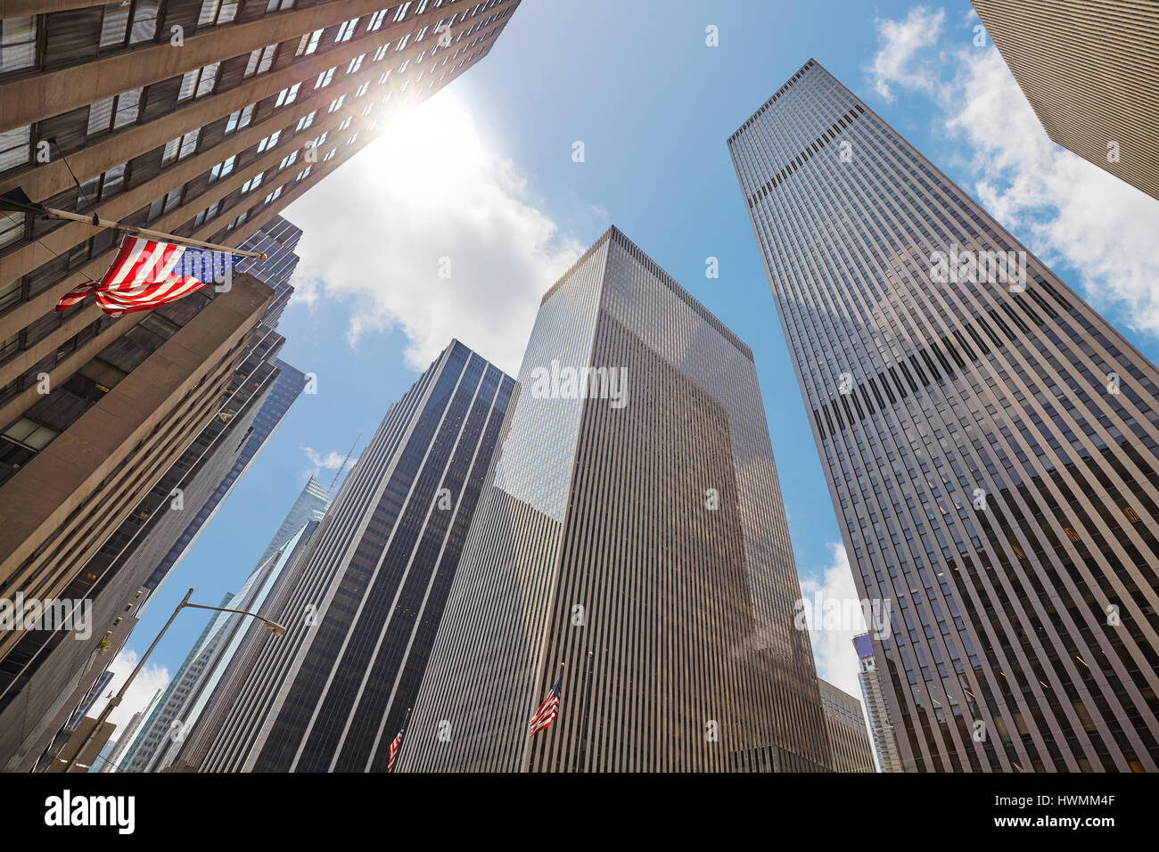 Photo of skyscrapers in Manhattan against the sun, looking up perspective, New York City, USA. Stock Photo