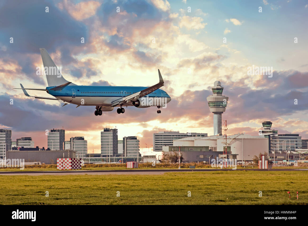 Airplane landing on Schiphol airport in Amsterdam in the Netherlands Stock Photo