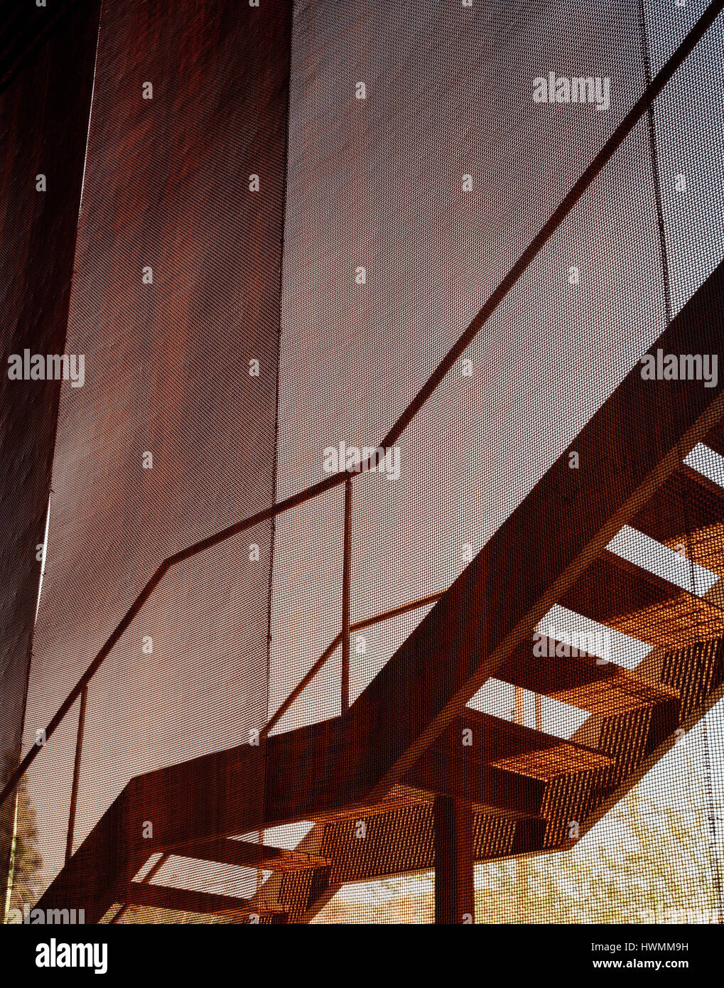 Detail of exterior staircase and mesh enclosure. Xeros House, Phoenix ...