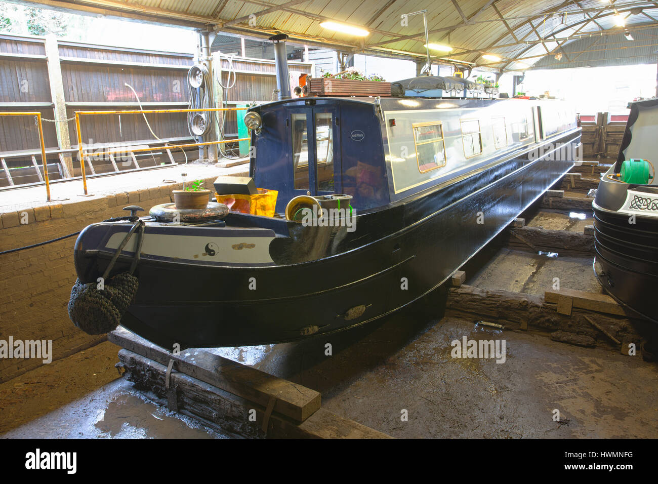 pair of narrowboats in dry dock for blacking Stock Photo - Alamy