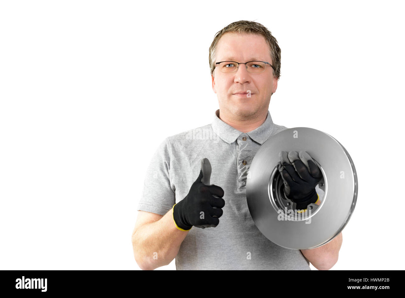 Car mechanic thumbs up for brake repair. New car parts for service and repair Stock Photo