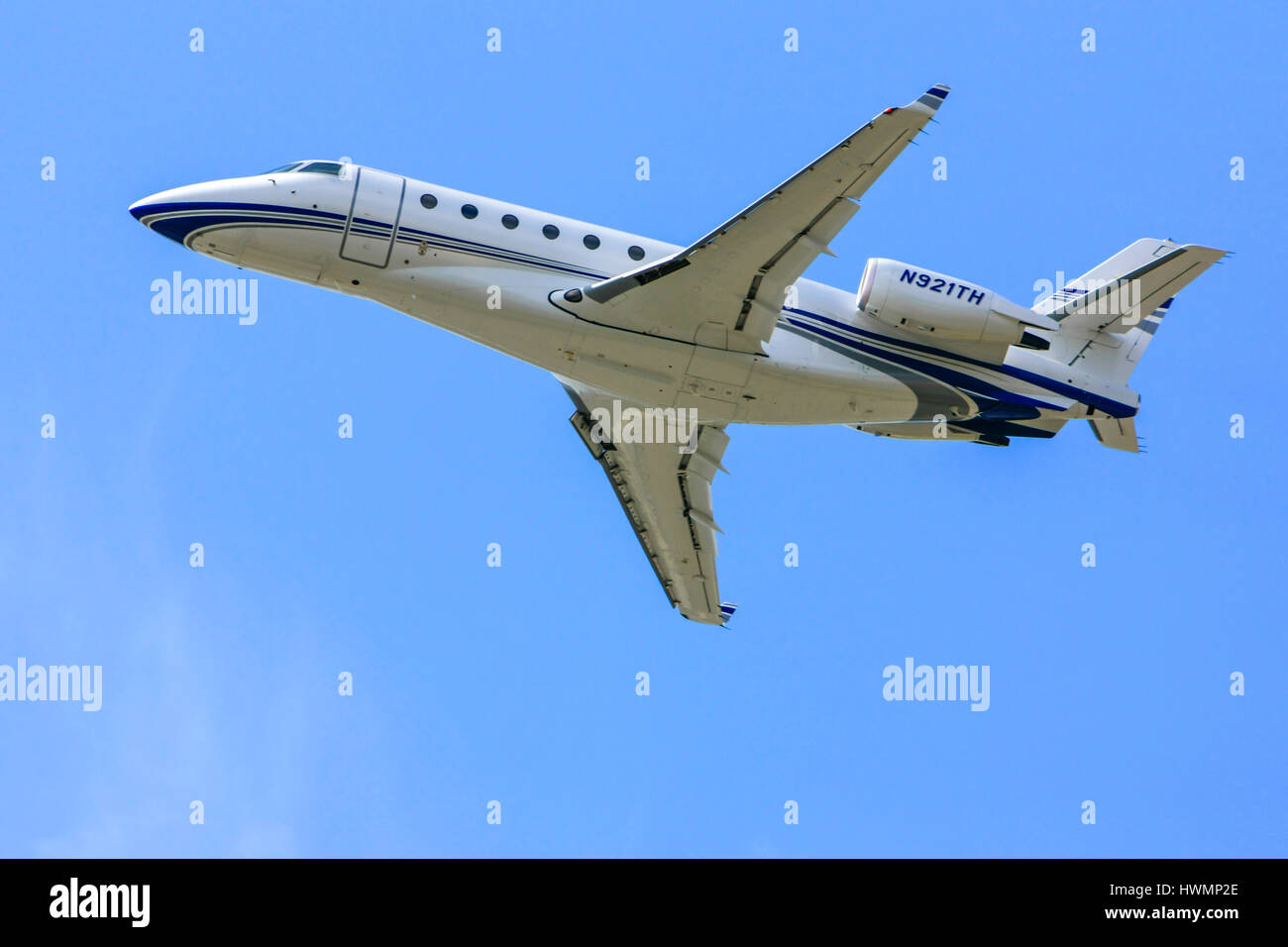 Galaxy G-200 personal executive jet over the skies of Sarasota SRQ airport in Florida Stock Photo