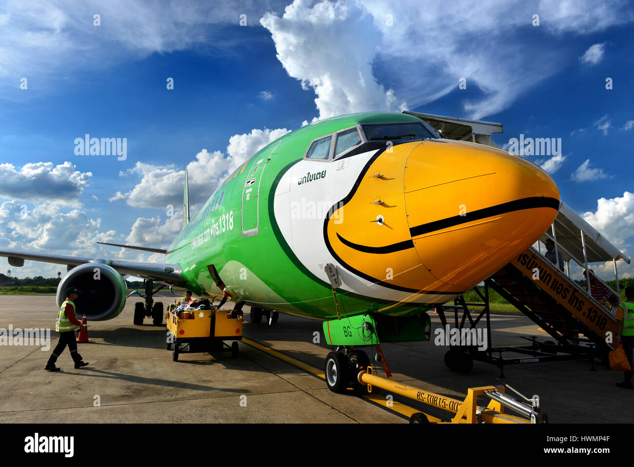 Udon Thani,Thailand August 22, 2015:Boeing 737-8FH from Nok air airline ,parking at the Udon Thani airport and unidentified men are working with the p Stock Photo