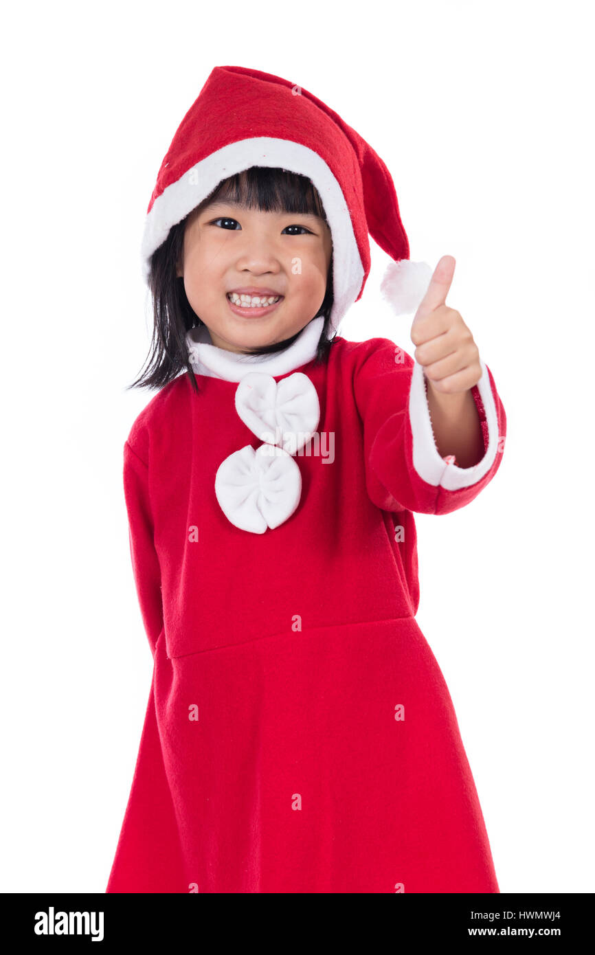 Happy Asian Chinese little santa claus girl with thumbs up in isolated ...