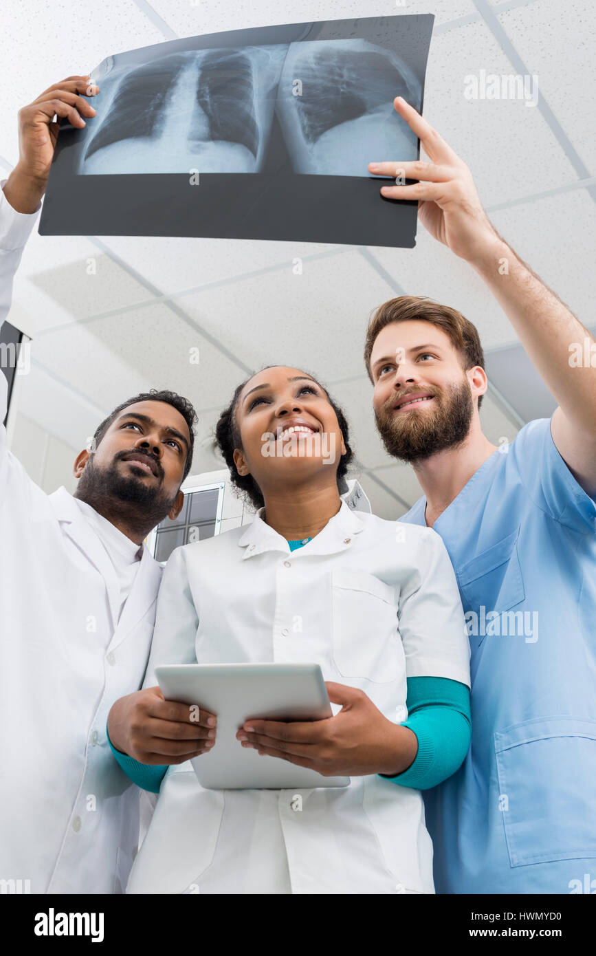 Male And Female Radiologists Examining Chest X-ray In Hospital Stock Photo