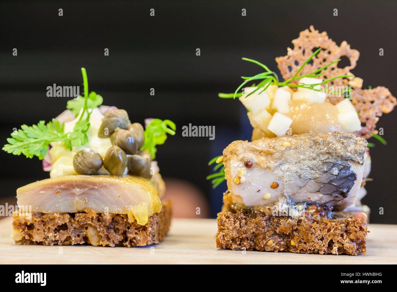 Denmark, Zealand, Copenhagen, Øster Farimagsgade, restaurant Aamanns smørrebrød (smeurebreud), rye bread with herring Stock Photo