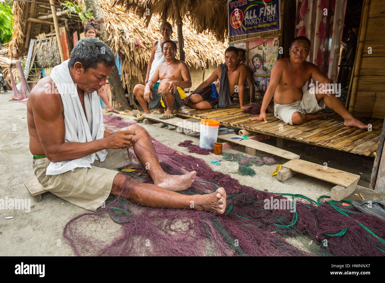 Philippines, Luzon, Sorsogon Province, Donsol, fisherman repairing his net Stock Photo