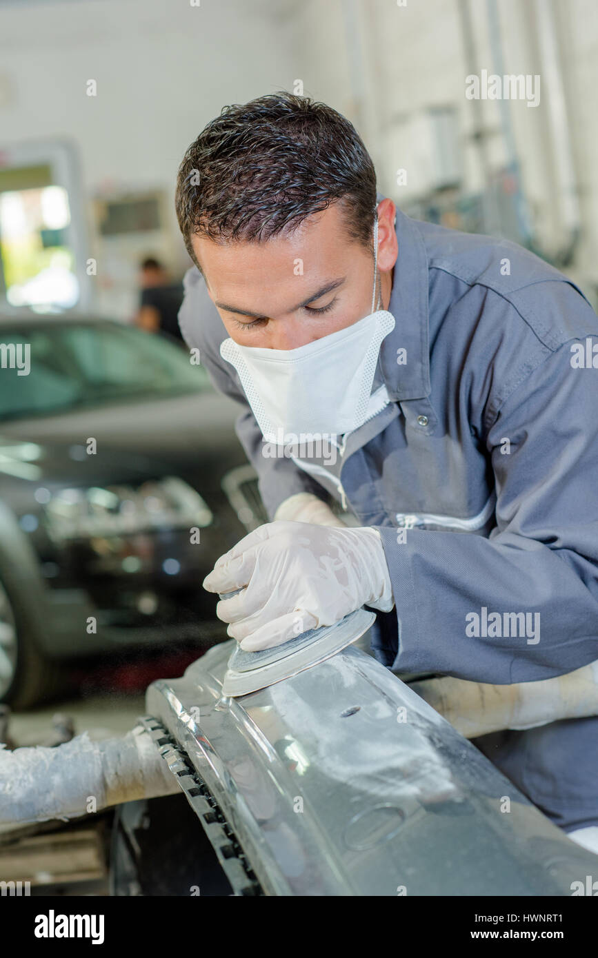 Mechanic sanding car bodywork Stock Photo Alamy