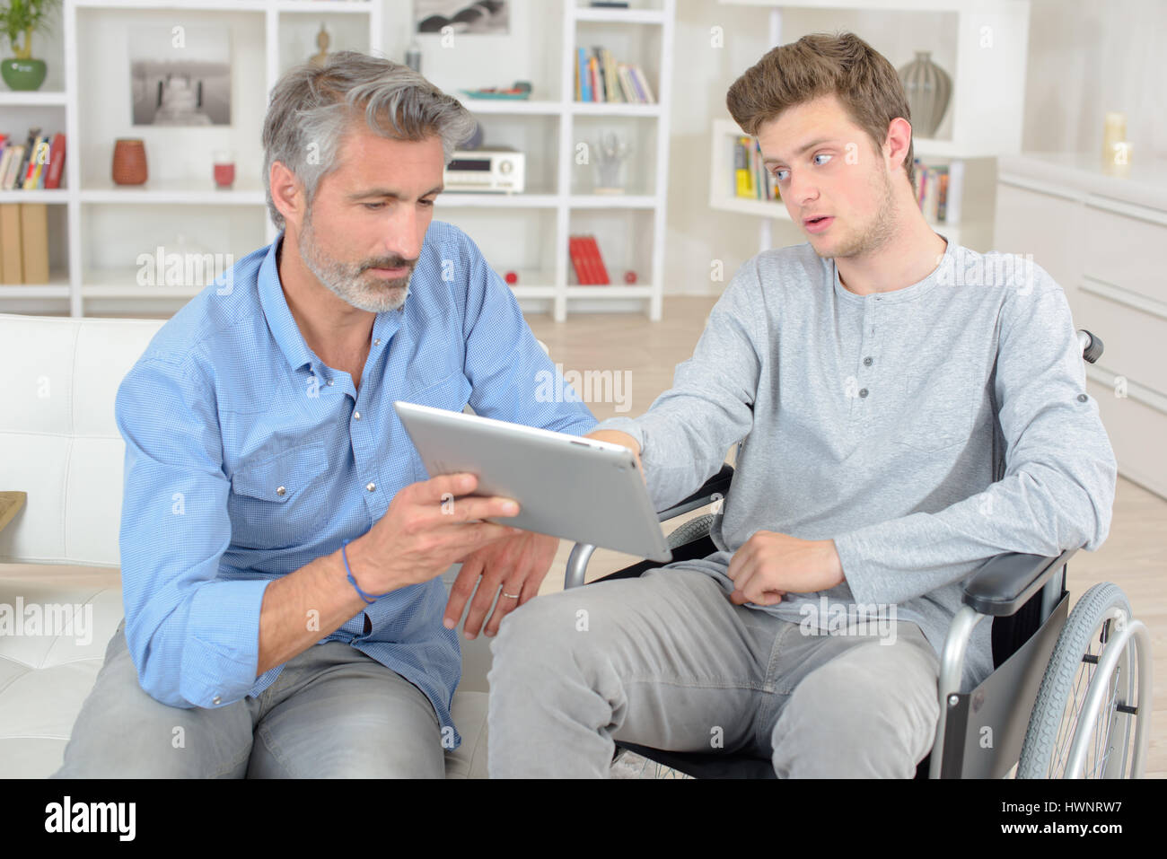 young man on a wheelchair Stock Photo - Alamy
