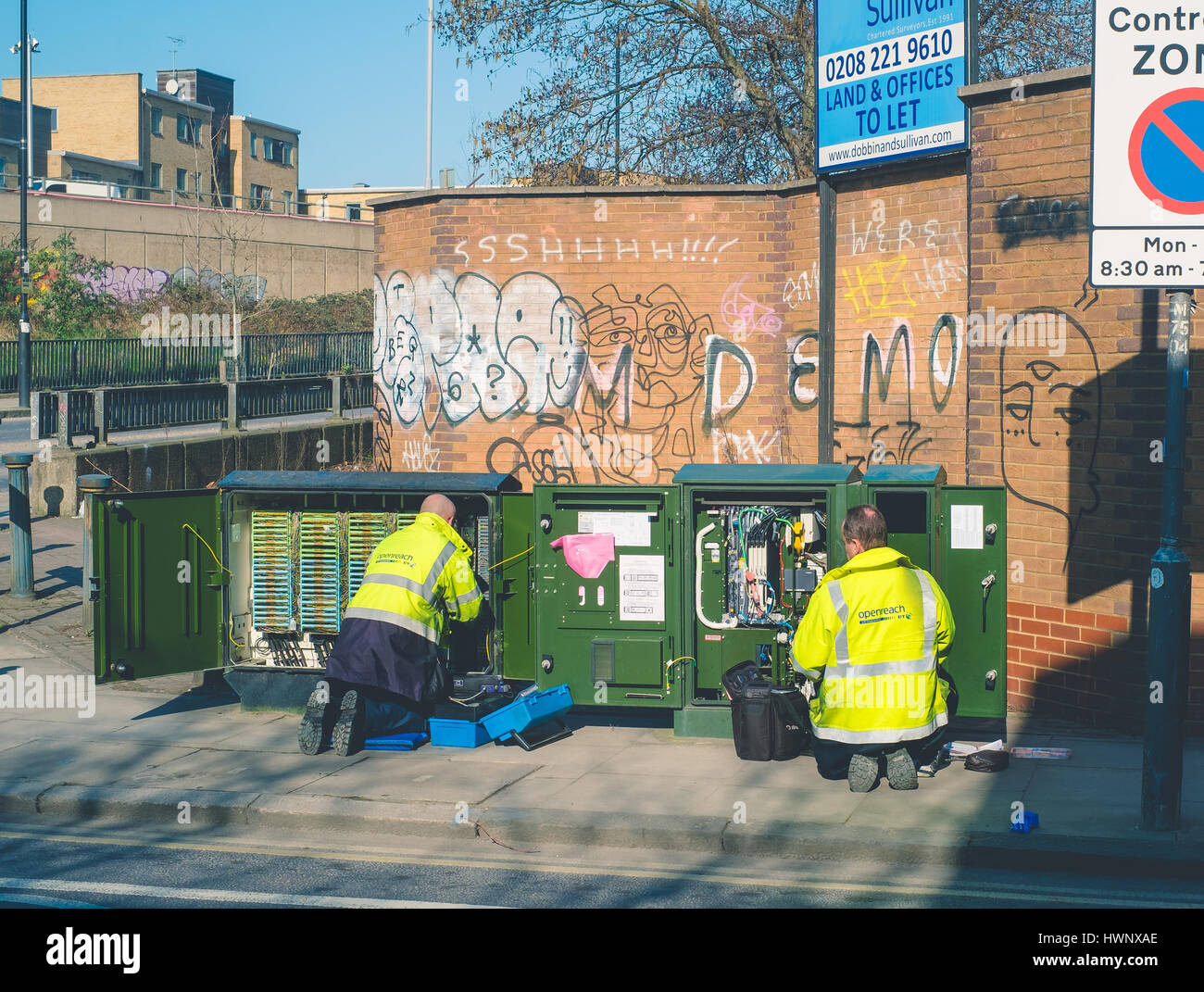 Workmen working on telephone exchange, BT openreach, East London UK