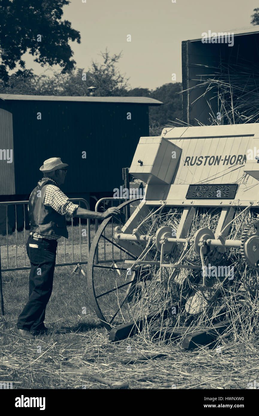 Demonstrating old farm machinery at the New Forest Show Hampshire UK Stock Photo