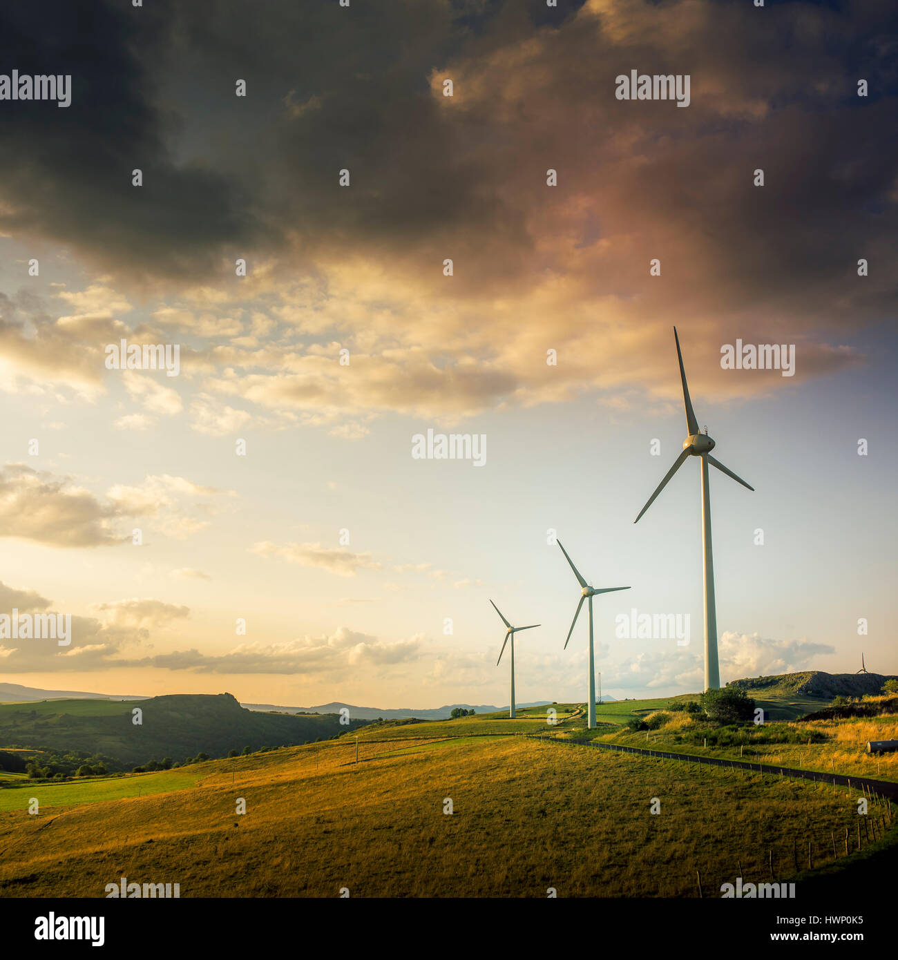 Windmills in a field in Puy-de-Dome, France Stock Photo