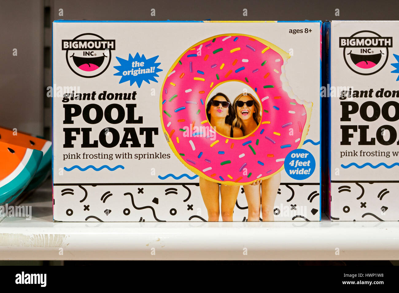 A giant donut shaped pool float for sale at It'sugar, a candy and novelty shop on Broadway in Greenwich Village, New York City Stock Photo