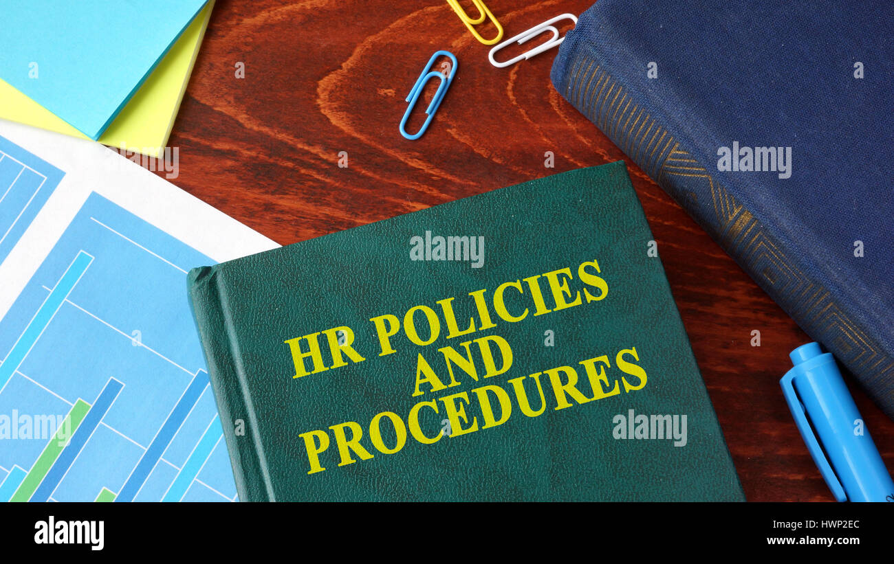 Book with title HR policies and procedures on a table. Stock Photo