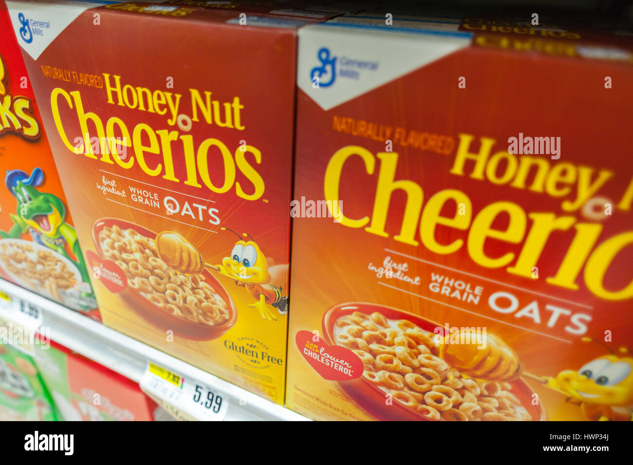 Boxes of General Mills Honey Nut Cheerios breakfast cereals featuring 'Buzz the Bee' in a supermarket in New York on Tuesday, March 21, 2017. General Mills is pulling 'Buzz the Bee' from its packaging to reiase consumer awareness of the declining bee population.  (© Richard B. Levine) Stock Photo