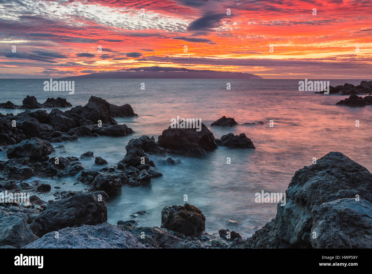 View of La Gomera, sunset, Playa de San Juan, Tenerife, Spain Stock Photo