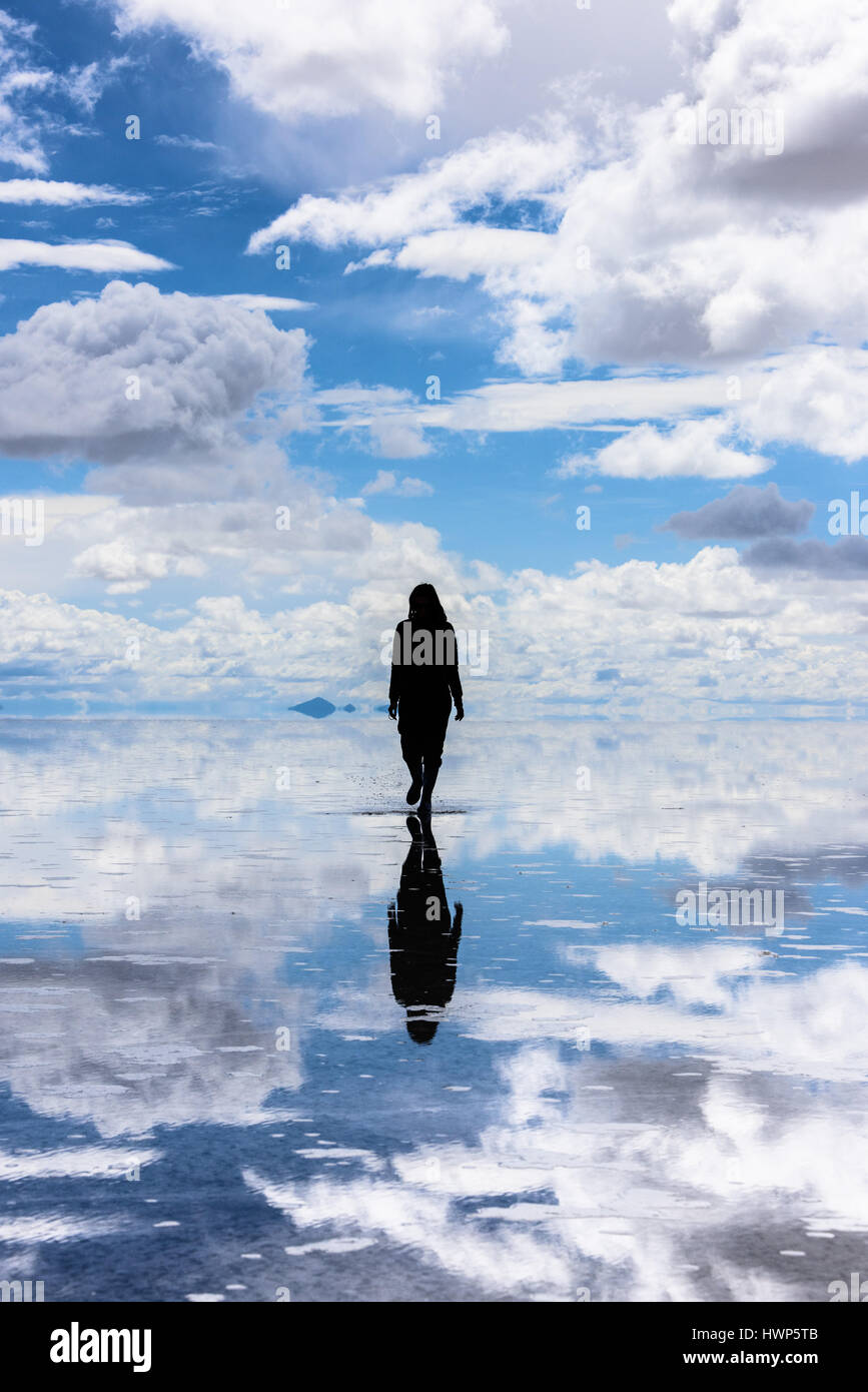 Because of rain and melting ice from the surrounding glaciers, the  Uyuni salt flat in Southern Bolivia is a giant mirror made of a few cm of water Stock Photo