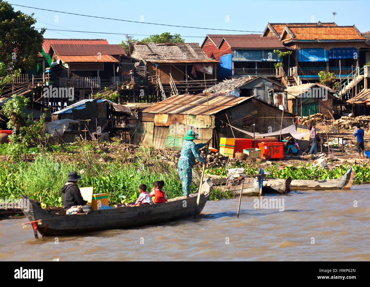 Cambodian family on way by boat to shopping at Kampong Chhnang Stock Photo